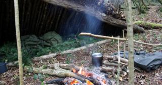 Lean-to shelter and spruce bough bed